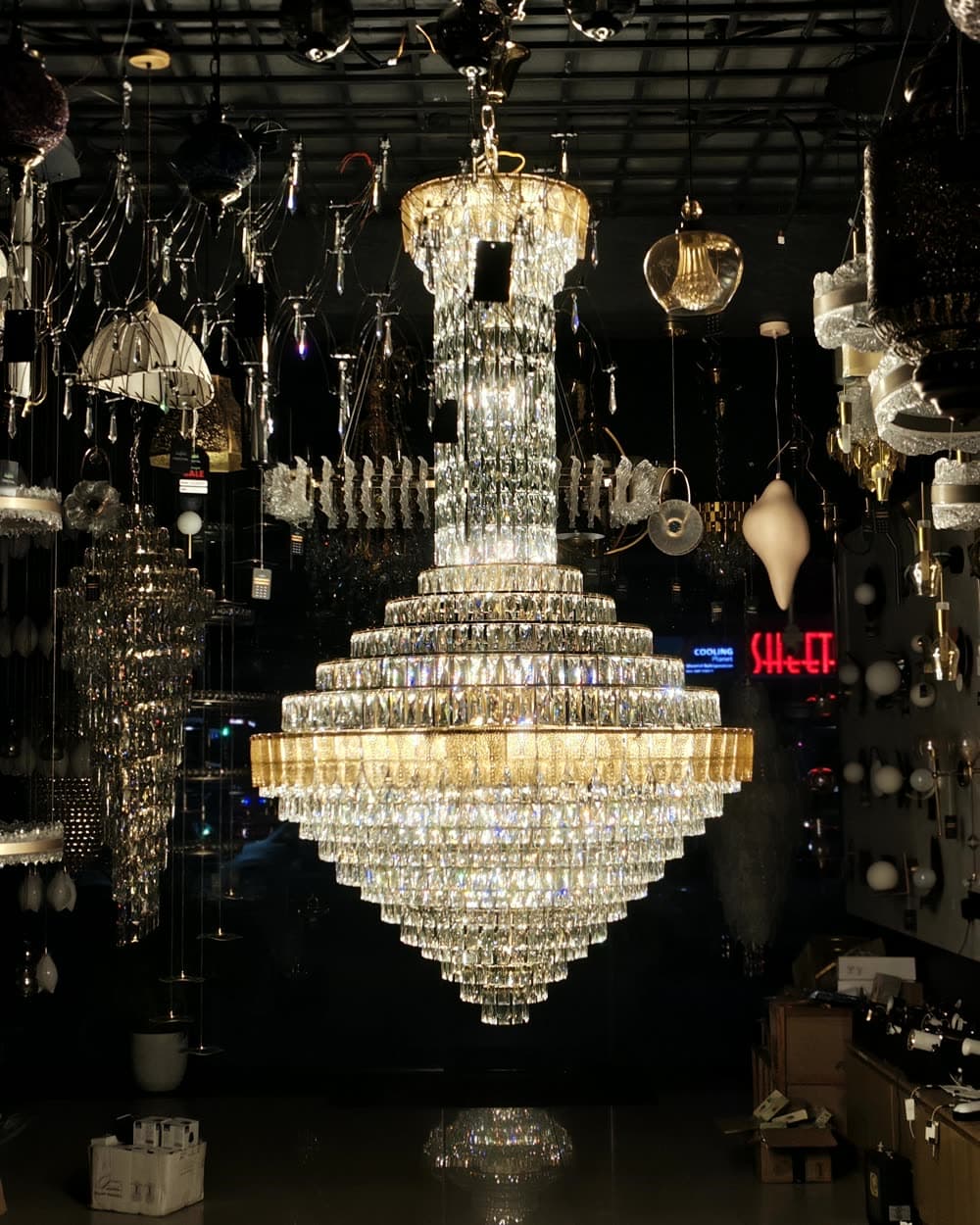 A grand chandelier lit inside the Celestial Lights showroom